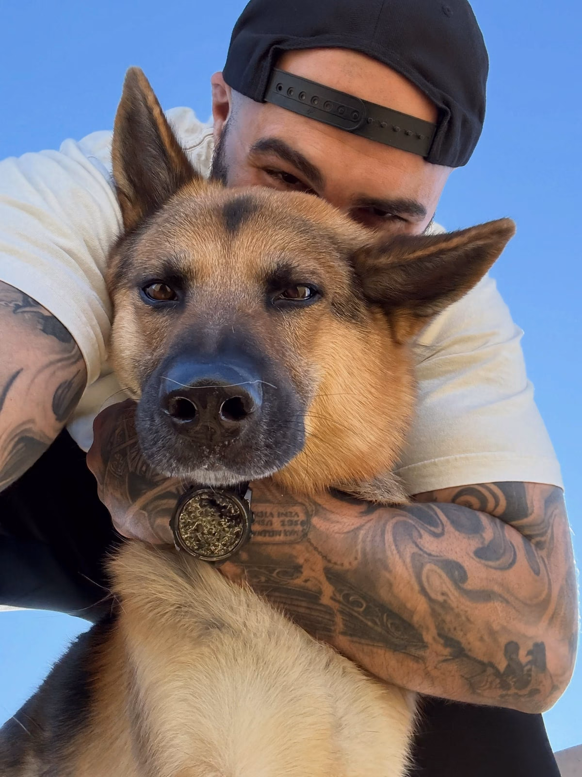 Sean with Apollo, his German Shepherd.