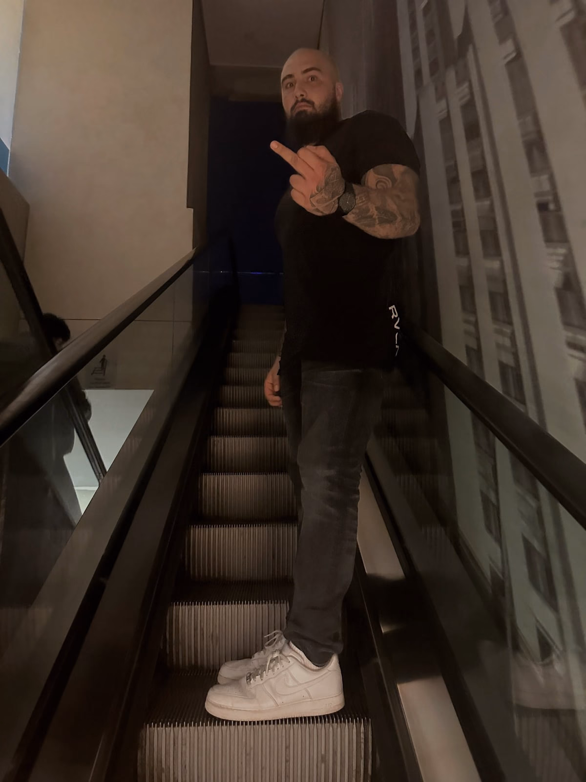On the stairs, pointing at the camera, the week of the fight.