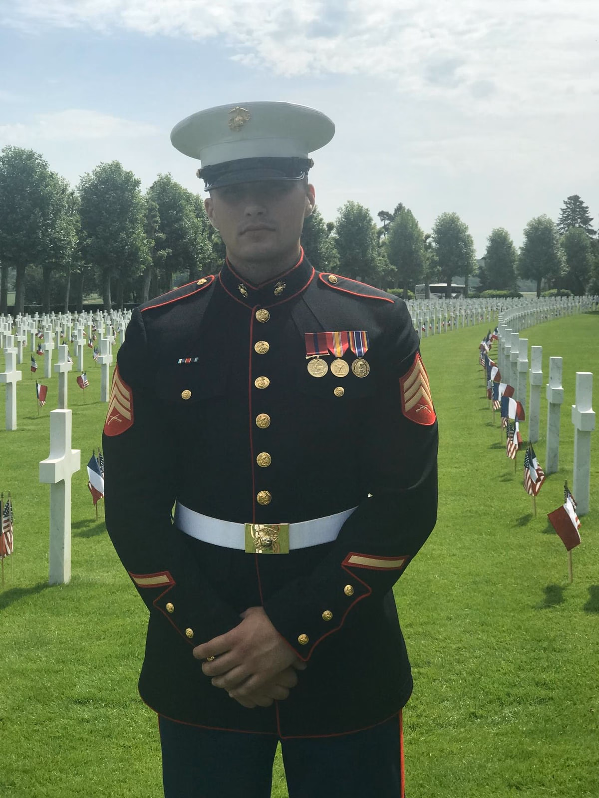 Sergeant Sharaf in dress blues at a military cemetery.